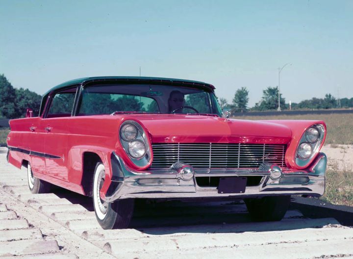 red car near railroad track