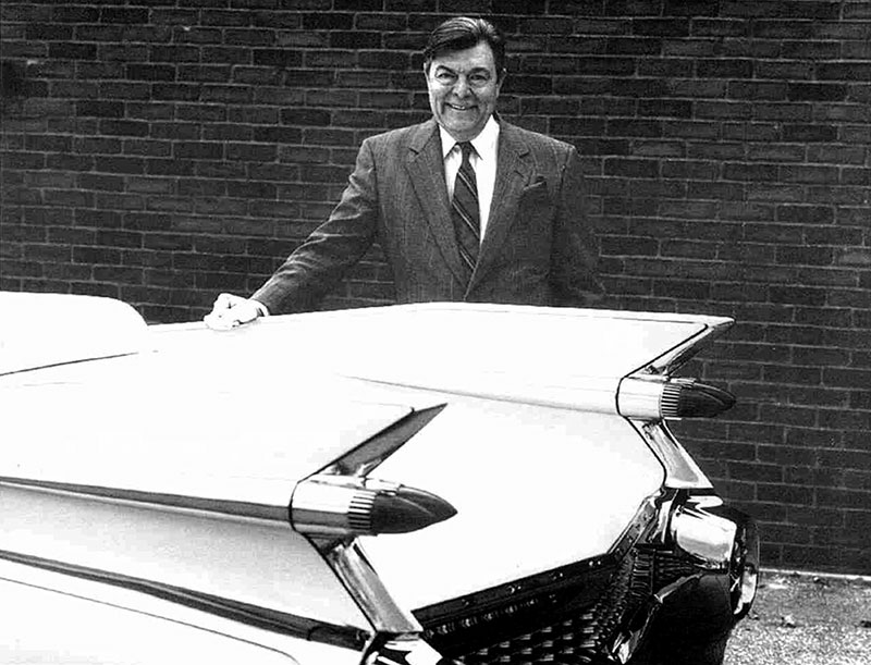 Dave Holls standing next to a 1959 Cadillac General Motors 3