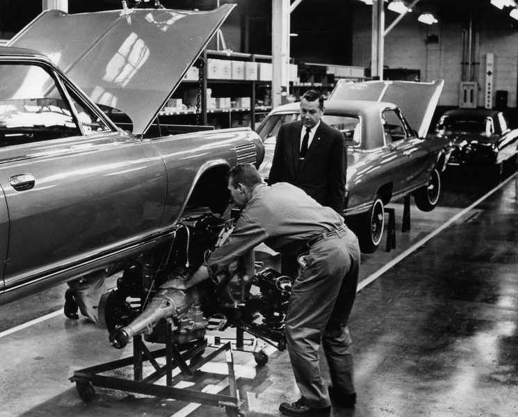 Lynn Townsend standing with the Chrysler Turbine assembly line Chrysler Archives 3