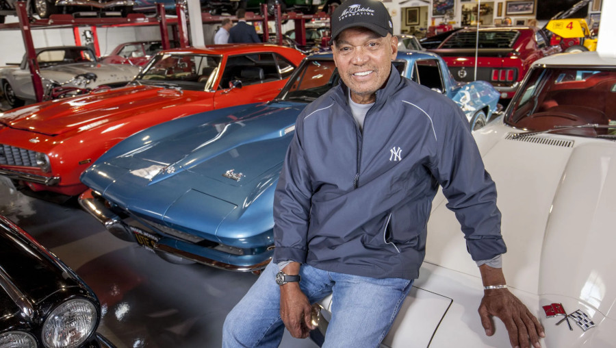 Reggie Jackson seated inside his car museum RESIZED