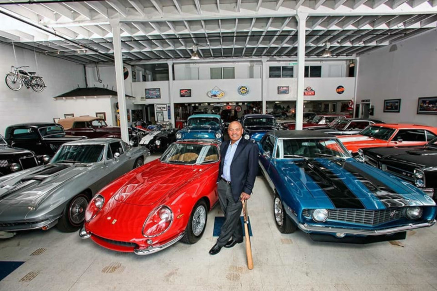 Reggie Jackson stands with his automotive collection RESIZED