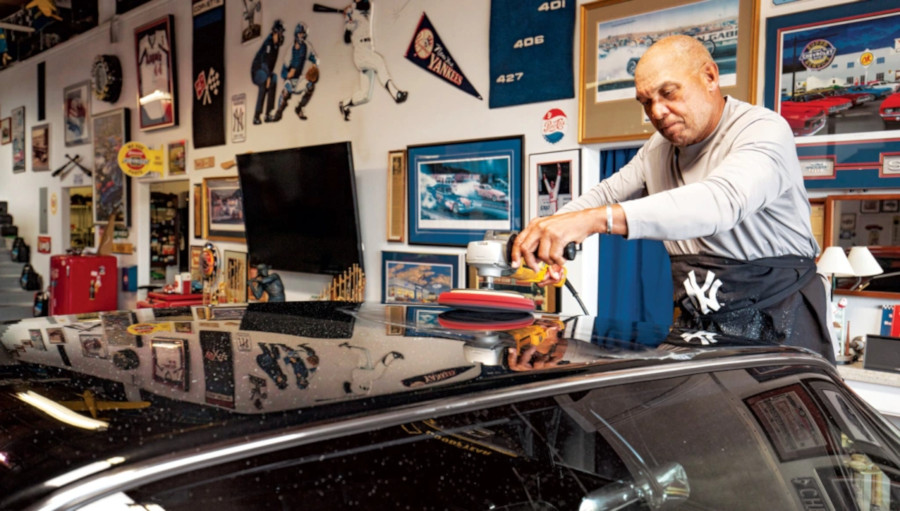 Reggie Jackson stands with one of his muscle cars RESIZED