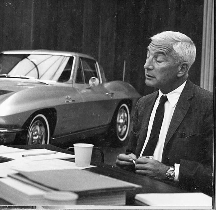 Zora Arkus Duntov sitting with a 1960s Corvette CROPPED 3