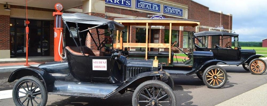 Model Ts parked in front of Ford dealership Gilmore Car Museum RESIZED