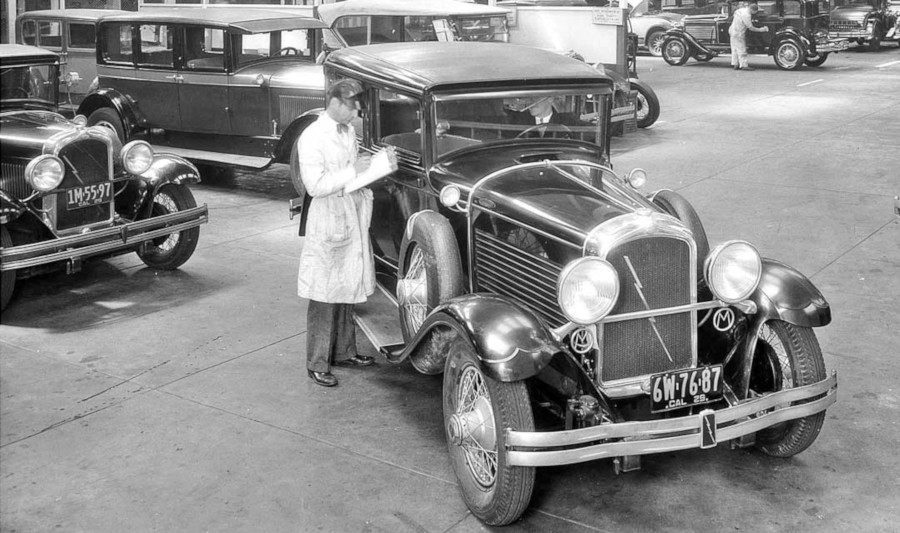 A 1929 Marmon sedan being checked out by an employee at a dealership The Old Motor Magazine RESIZED 5