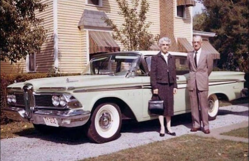 Couple standing with their 1959 Edsel