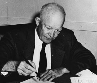 Dwight Eisenhower signs act on September 9 1957 Image Courtesy of USN